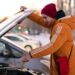 a-young-man-in-a-yellow-jacket-checks-the-oil-level-ways-start-diesel-engine-cold-heater-parts-power-performance